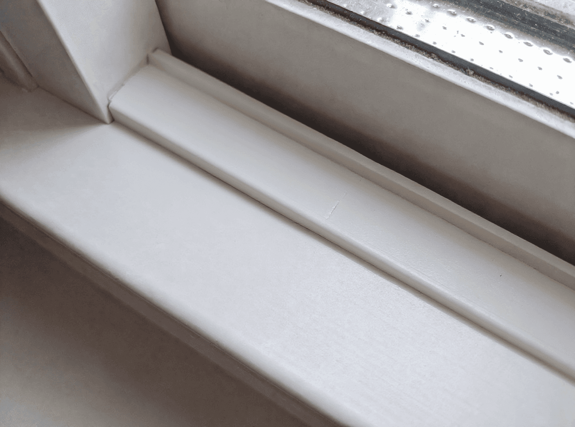 The same window track clean and clear after detailing